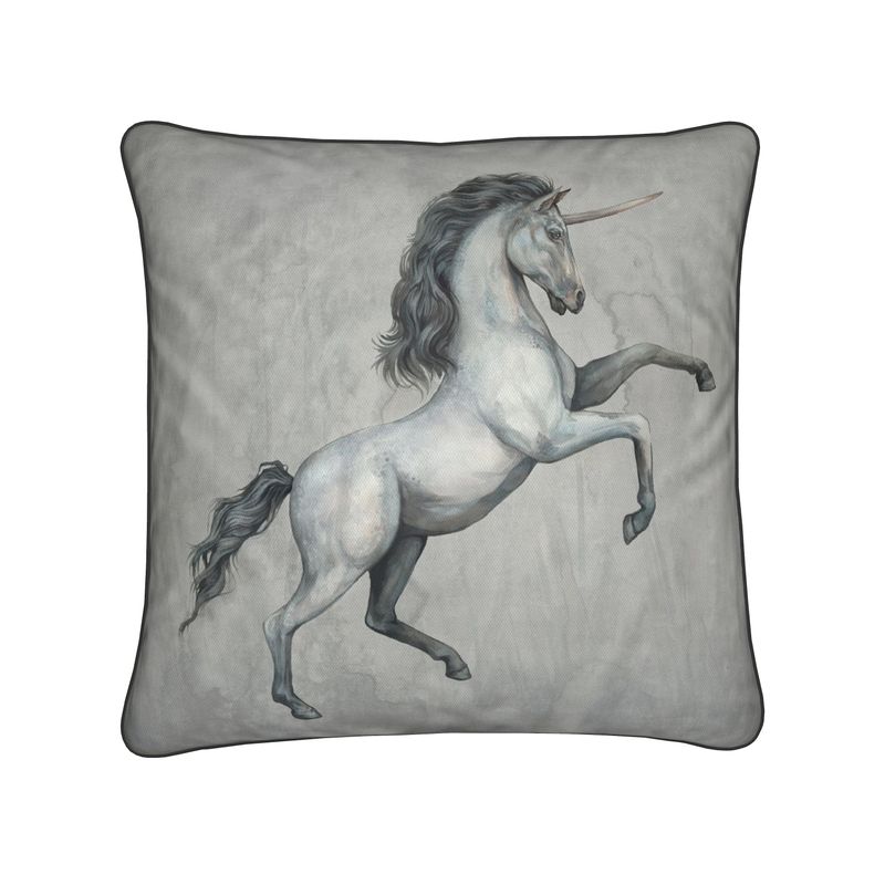 Decorative pillow with a unicorn design on a gray background
