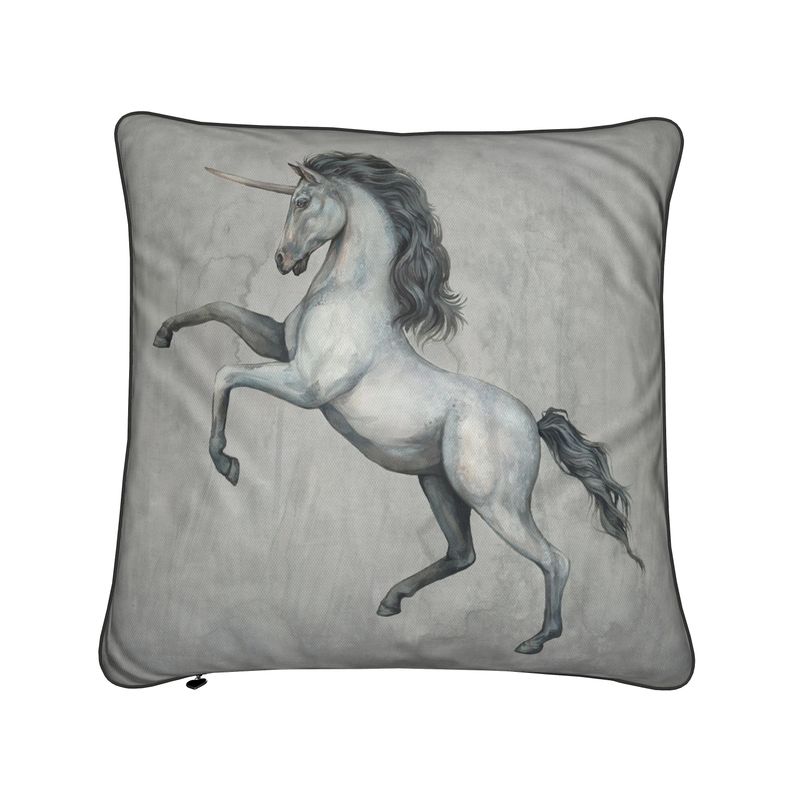 Decorative pillow with a unicorn design on a gray background