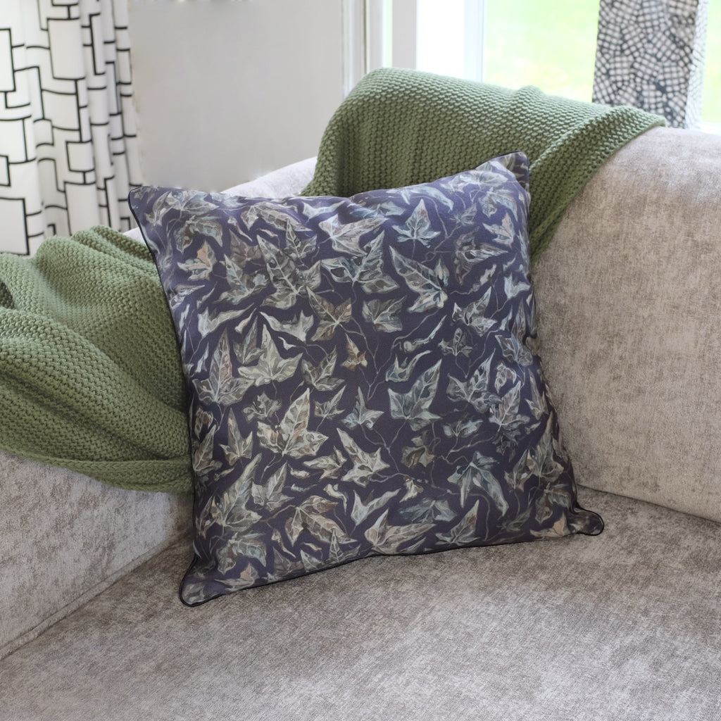 Decorative pillow with leaf pattern on a sofa