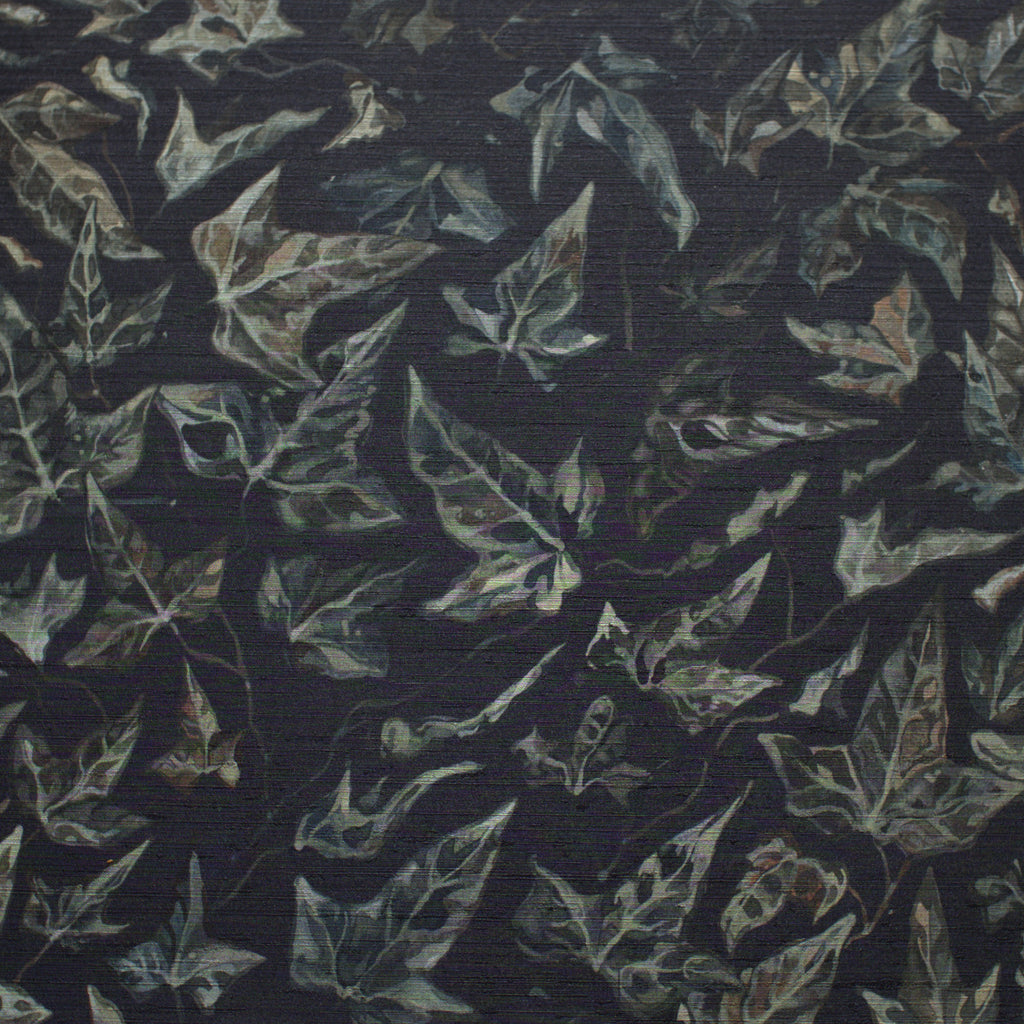 Close up of textured wallpaper featuring an ivy motif on a white background.