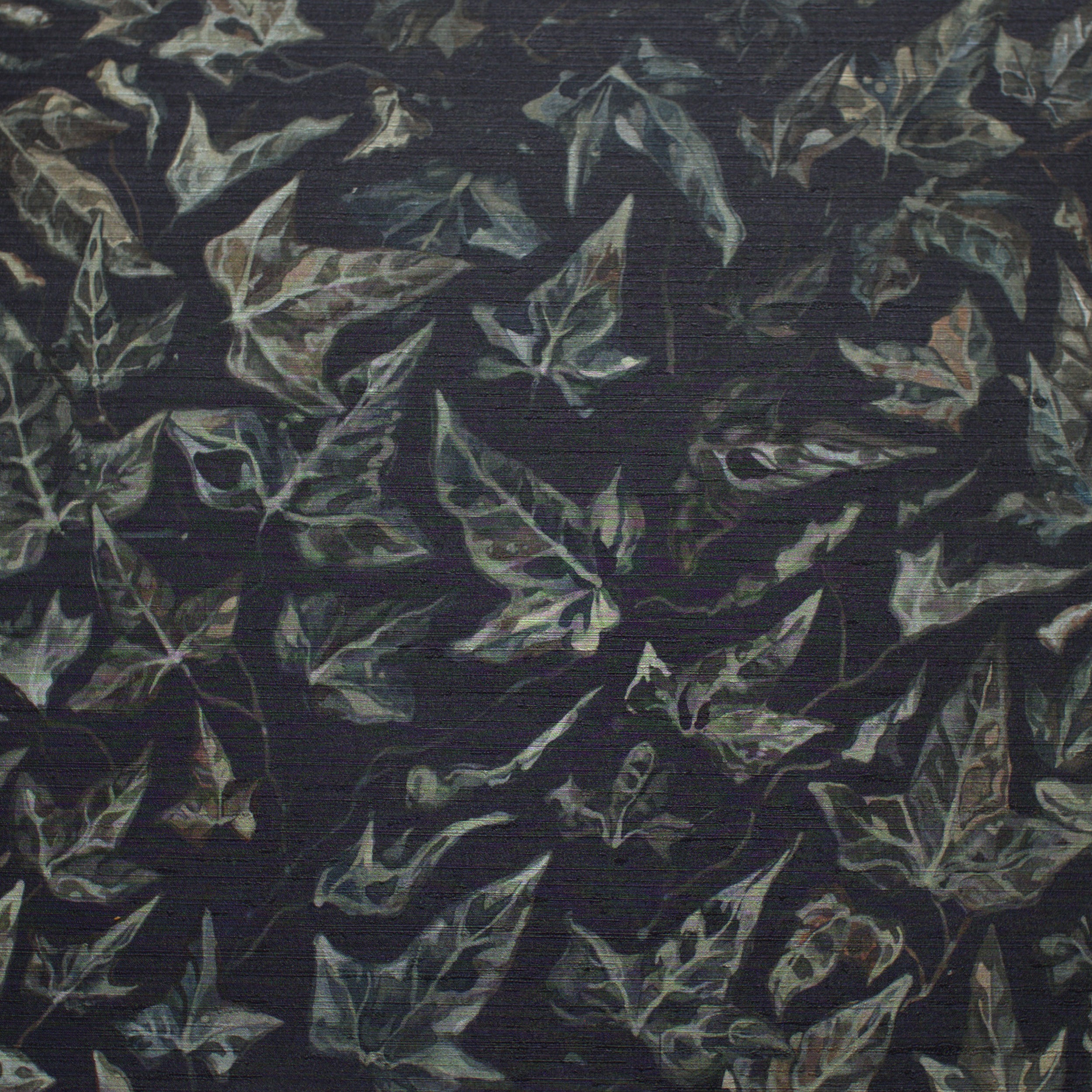 Close up of textured wallpaper featuring an ivy motif on a white background.