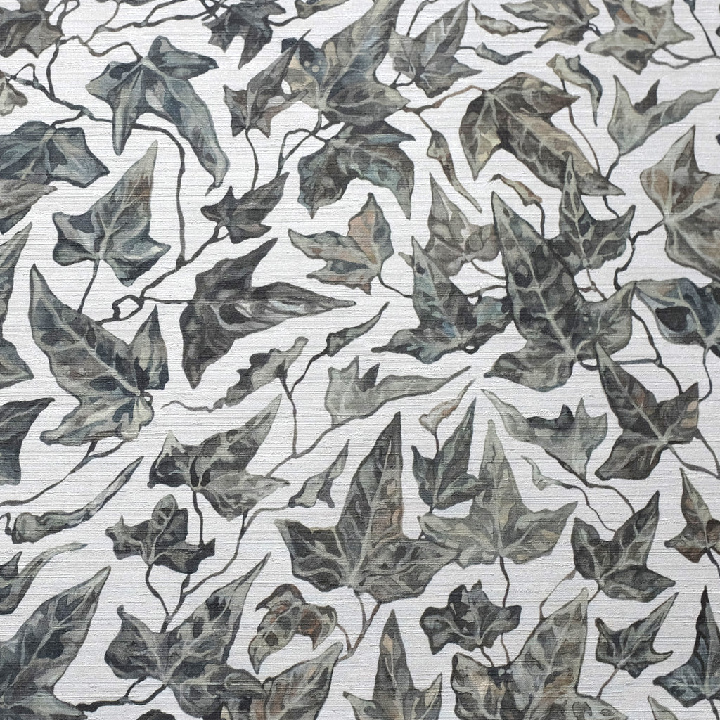 Close up of textured wallpaper featuring an ivy motif on a white background.