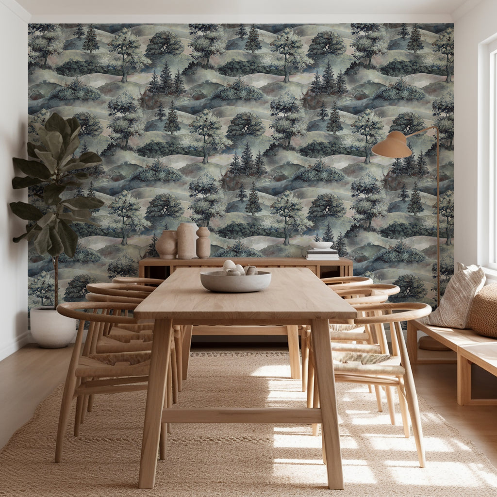 Dining room with wooden table and chairs against a forest-themed wallpaper.
